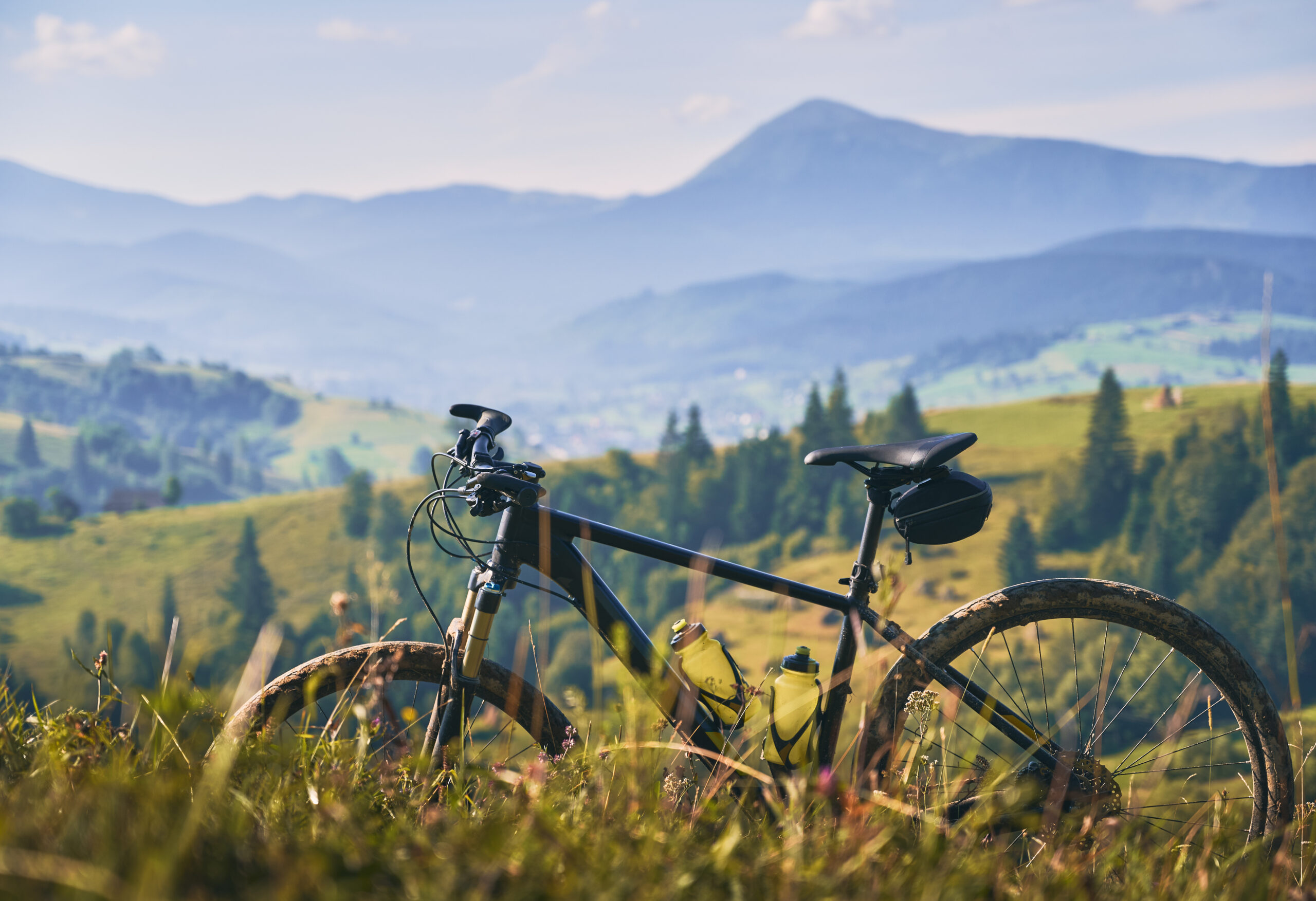 young man riding a mountain bike downhill style